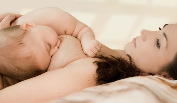 baby-breastfeeding-on-Lingerie-Briefs